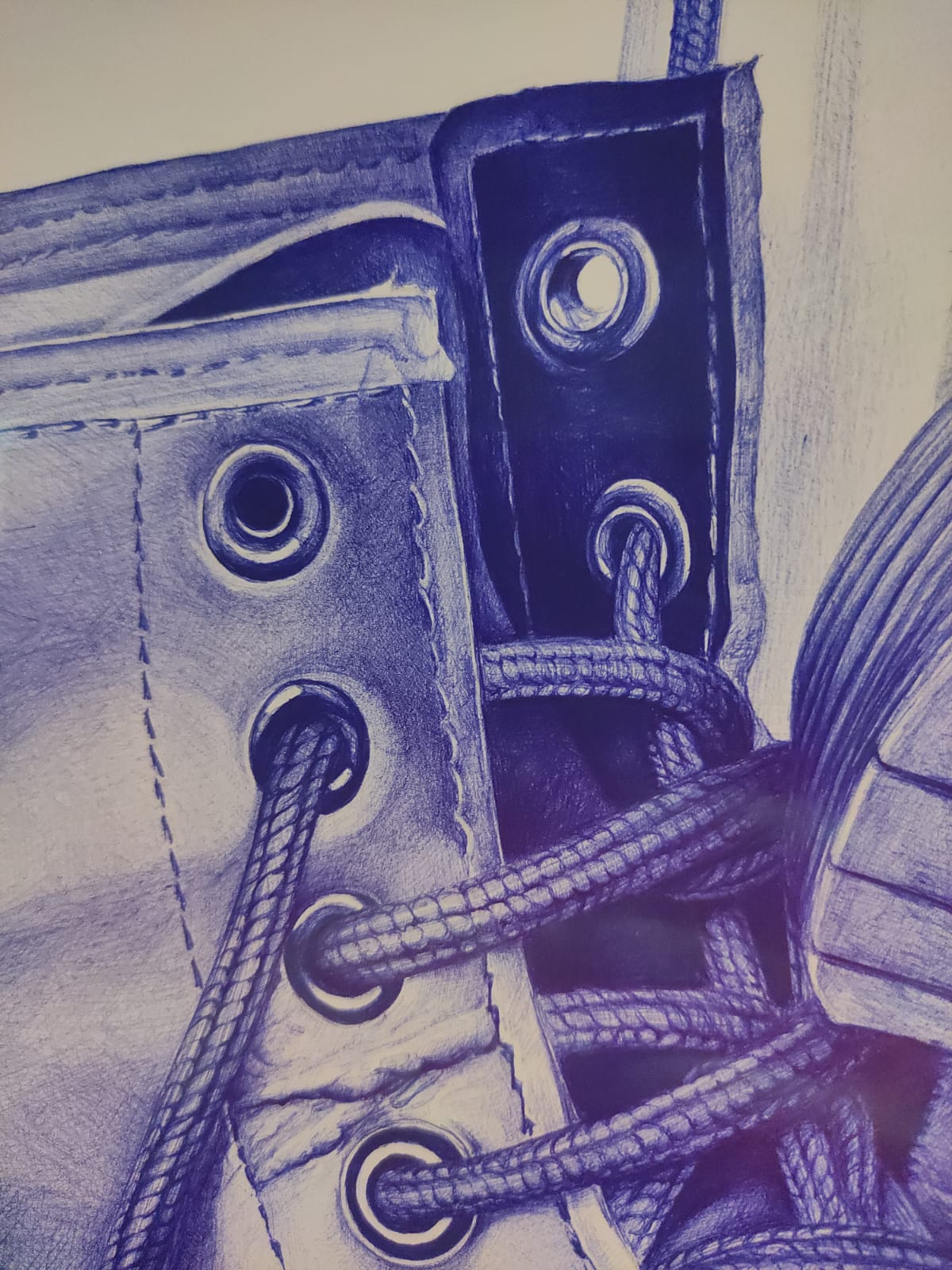 img 20240530 wa0033 Dessin détaillé de lacets sur chaussure en bleu.